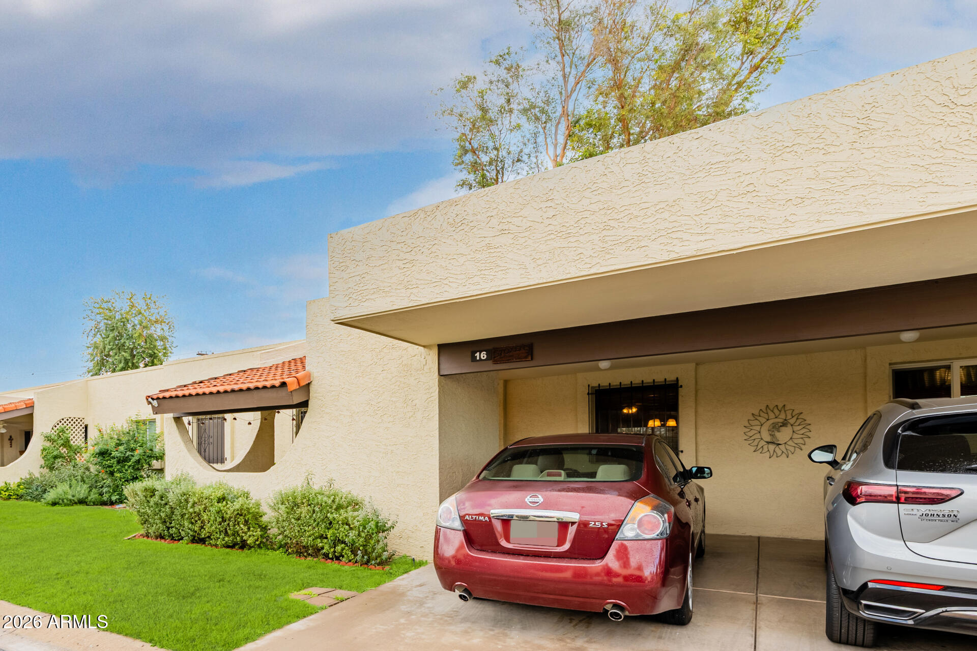 131 North Higley Road, Unit 16 Mesa, AZ 85205 - Photo 14 of 17 a car parked in front of garage