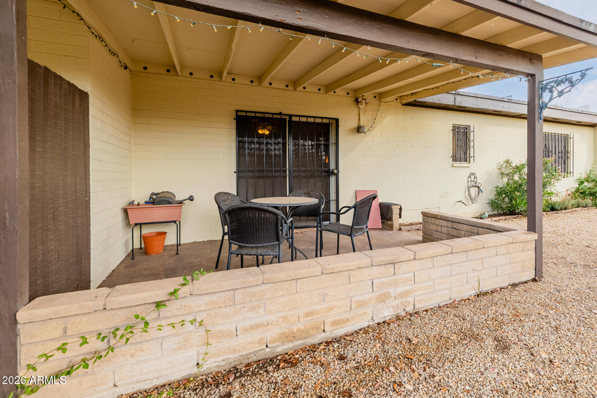 131 North Higley Road, Unit 16 Mesa, AZ 85205 - Photo 4 of 17 a view of a lounge chair in the patio