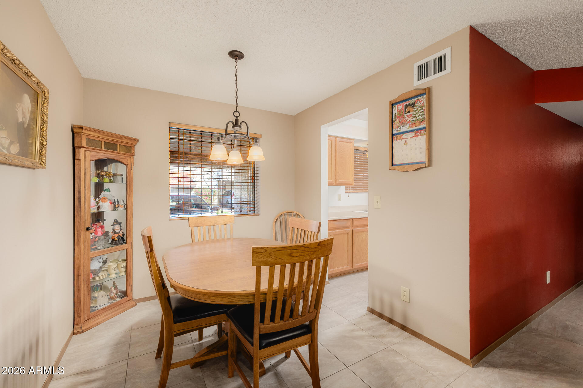 131 North Higley Road, Unit 16 Mesa, AZ 85205 - Photo 6 of 17 a dining room with furniture and window