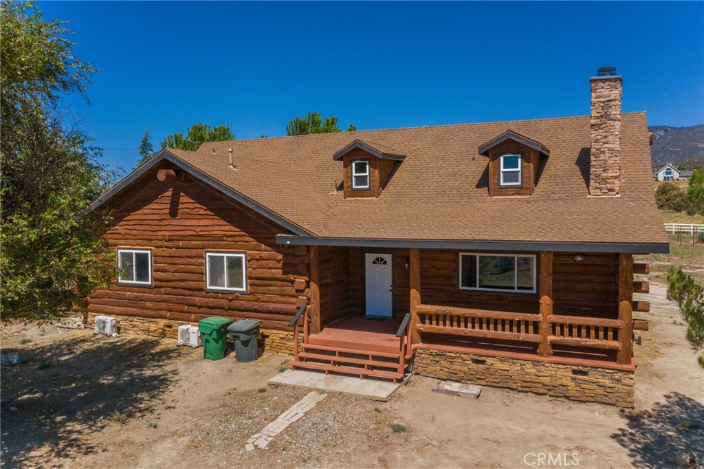 a front view of a house with stairs