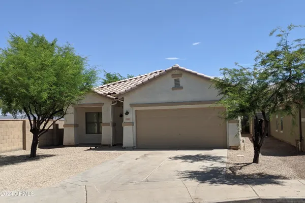 a front view of a house with a garage