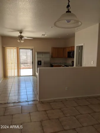 a view of a kitchen with a sink and wooden floor