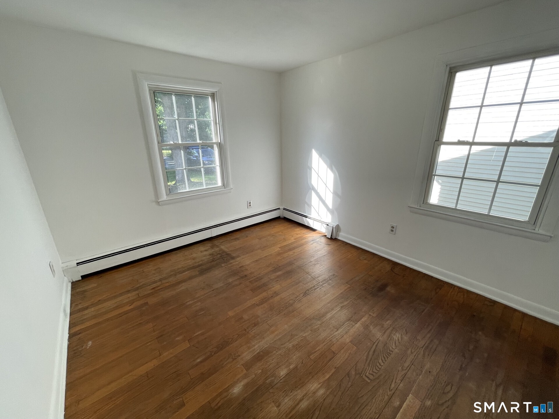8 Prospect Hill Deep River, CT 06417 - Photo 11 of 16 an empty room with wooden floor and windows