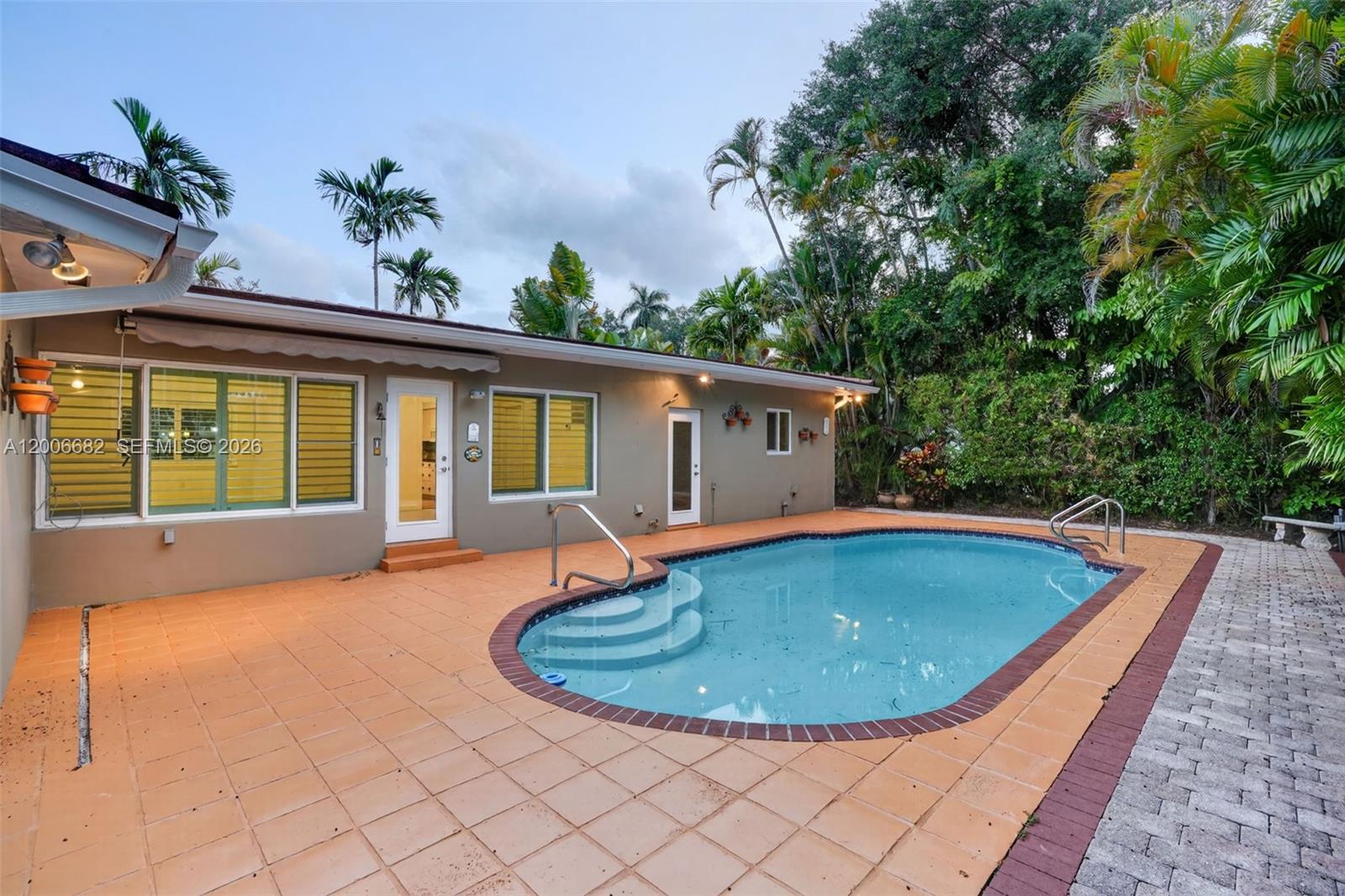 1435 Blue Road Coral Gables, FL 33146 - Photo 28 of 31 a view of a swimming pool with a outdoor seating