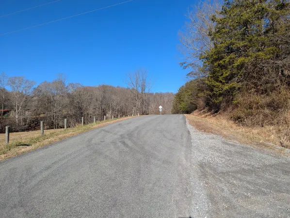 a view of a road with a building in the background