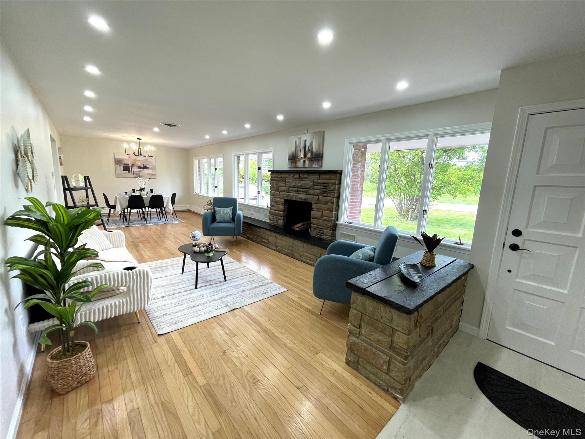 70 County Rte 17 Pine Bush, NY 12566 - Photo 13 of 36 a living room with furniture and a fireplace
