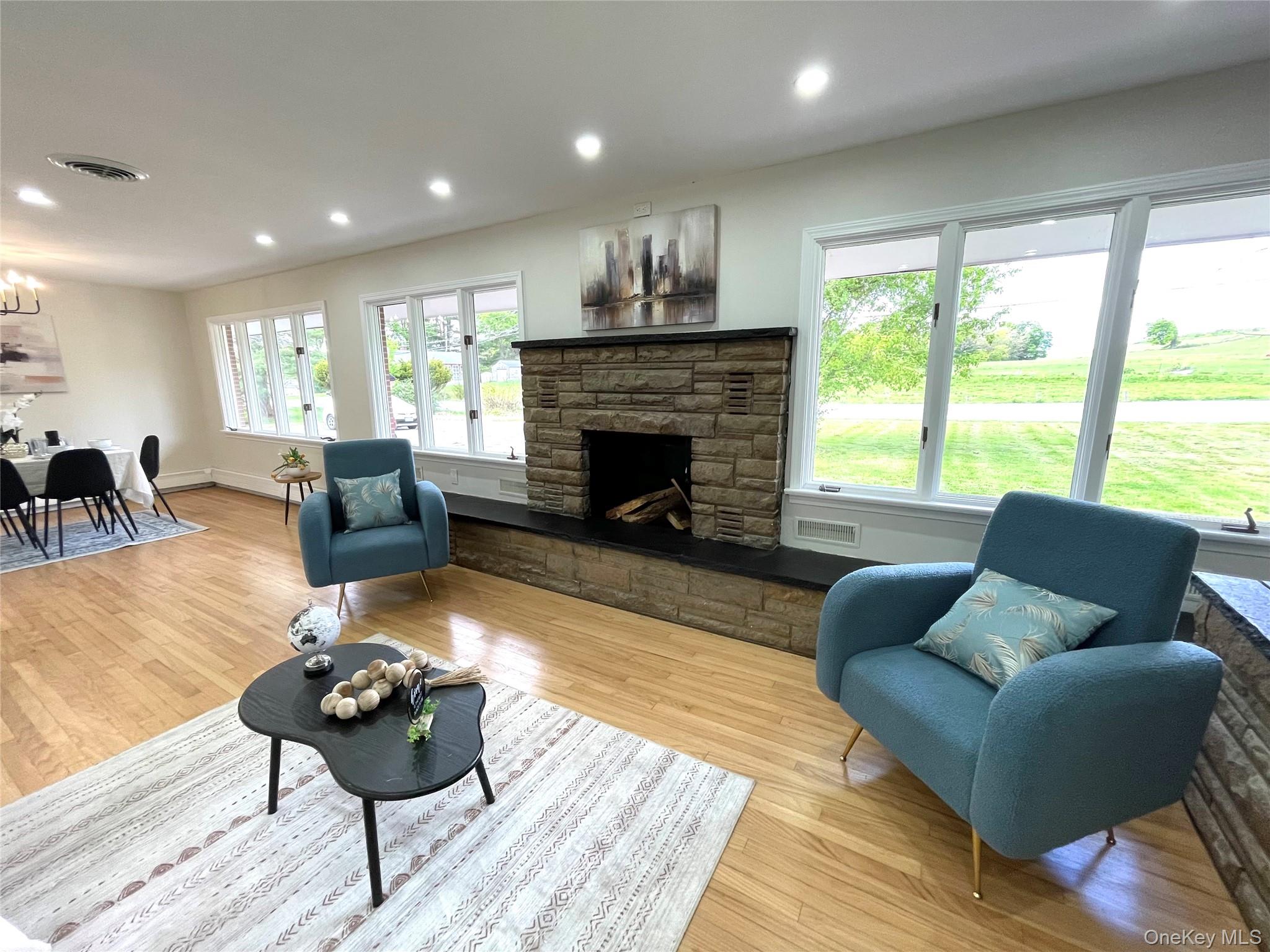 70 County Rte 17 Pine Bush, NY 12566 - Photo 17 of 36 a living room with furniture and a fireplace