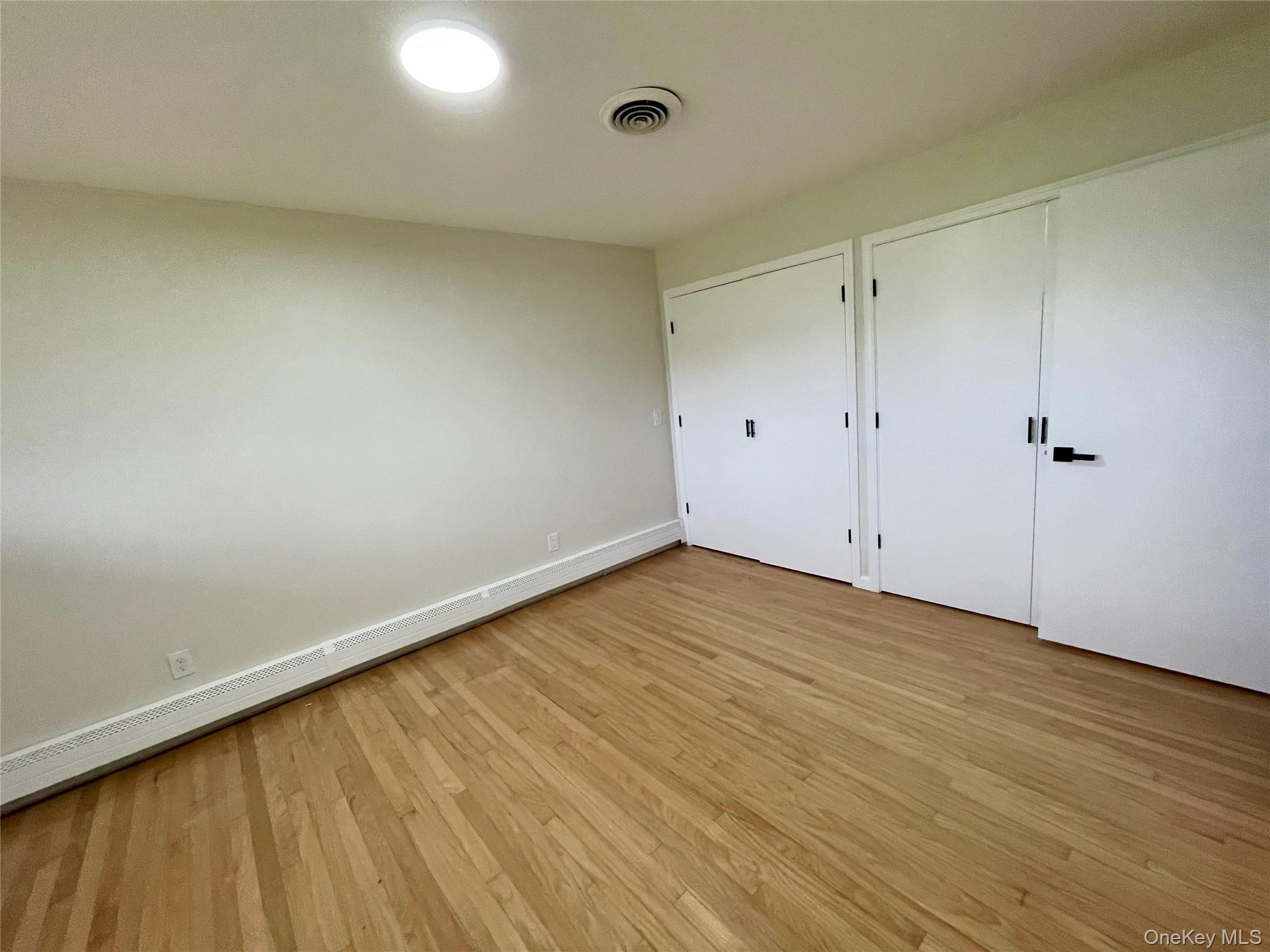70 County Rte 17 Pine Bush, NY 12566 - Photo 29 of 36 a view of an empty room with wooden floor