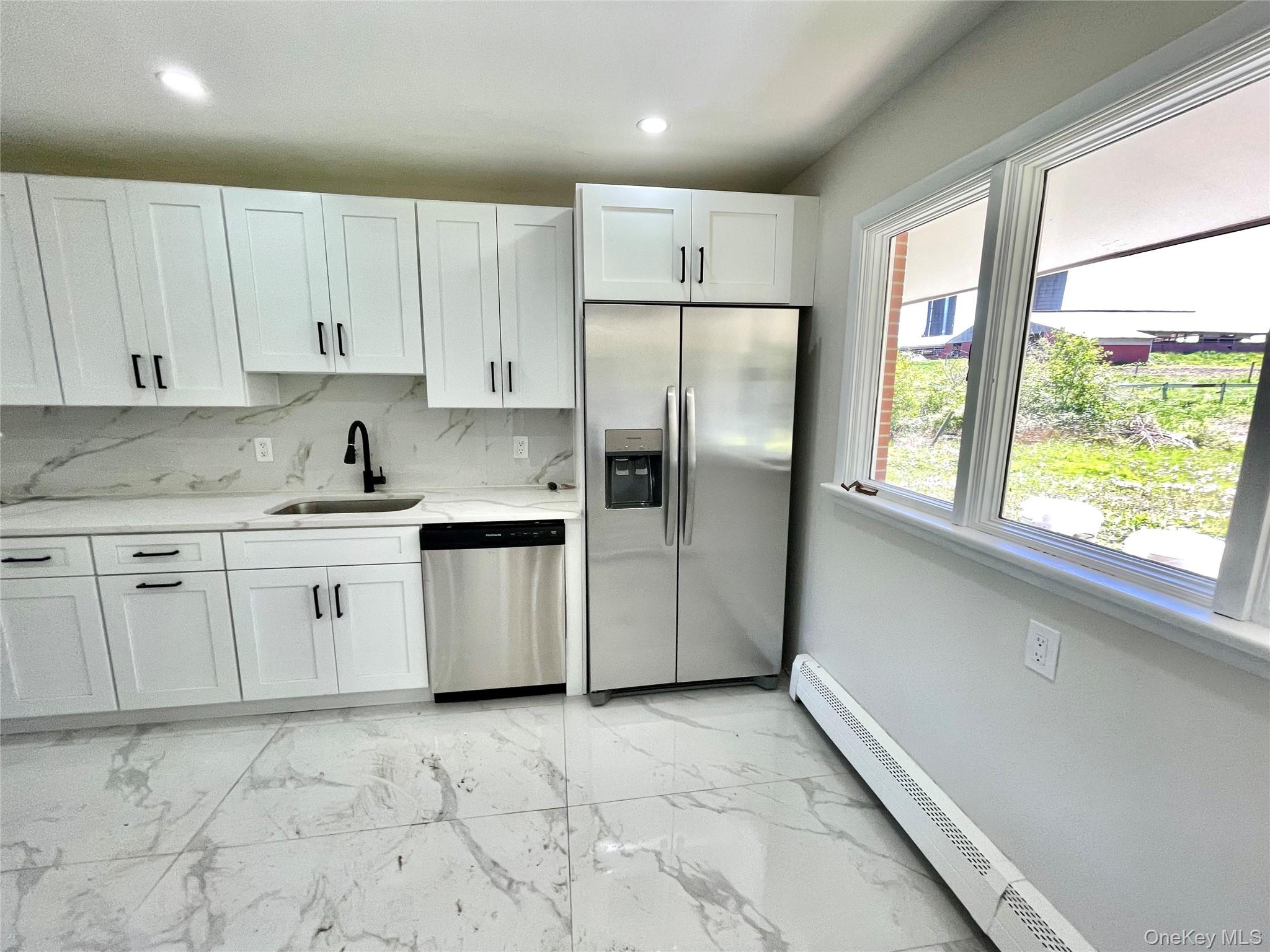 70 County Rte 17 Pine Bush, NY 12566 - Photo 6 of 36 a kitchen with granite countertop white cabinets and white stainless steel appliances