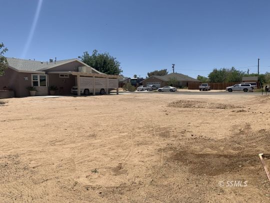 1320 Mayo Street Ridgecrest, CA 93555 - Photo 40 of 45 a front view of a house with a yard