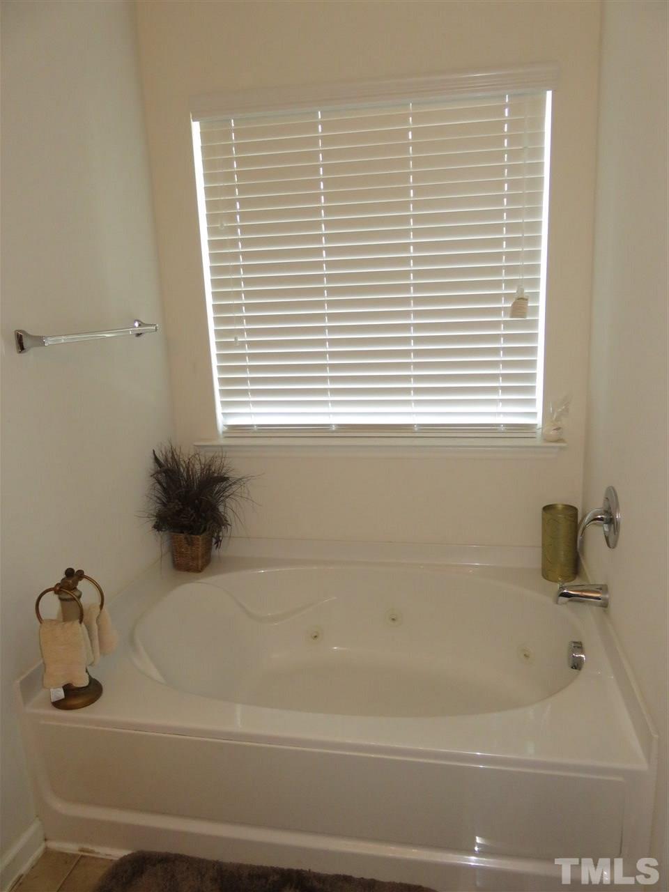 5532 Quitman Trail Raleigh, NC 27610 - Photo 22 of 29 a bathroom with a bathtub