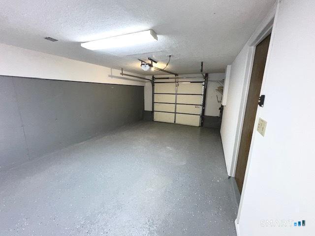 97 Country Hill Road, Unit 97 Naugatuck, CT 06770 - Photo 19 of 31 a view of a hallway with workspace