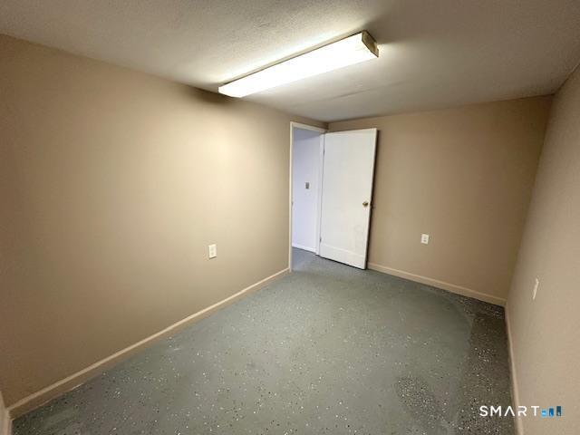 97 Country Hill Road, Unit 97 Naugatuck, CT 06770 - Photo 21 of 31 an empty room with an entryway