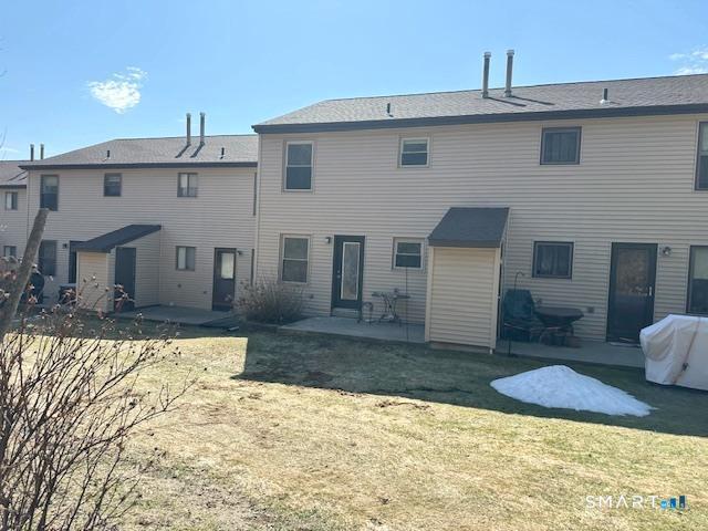 97 Country Hill Road, Unit 97 Naugatuck, CT 06770 - Photo 25 of 31 a front view of a house with a yard