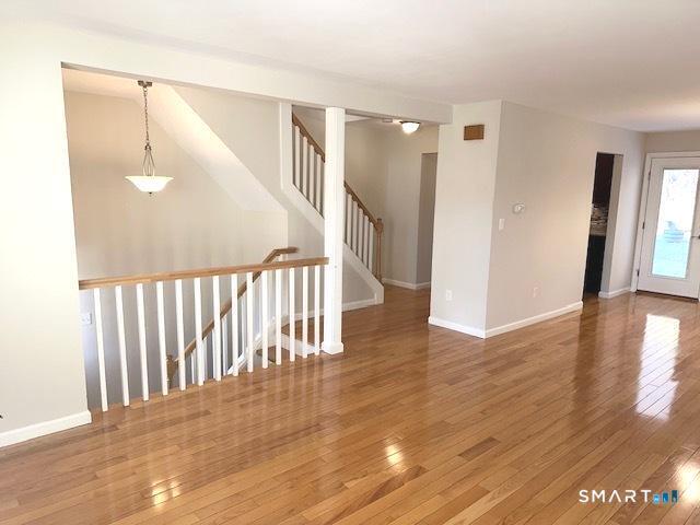 97 Country Hill Road, Unit 97 Naugatuck, CT 06770 - Photo 6 of 31 a view of a hallway with wooden floor