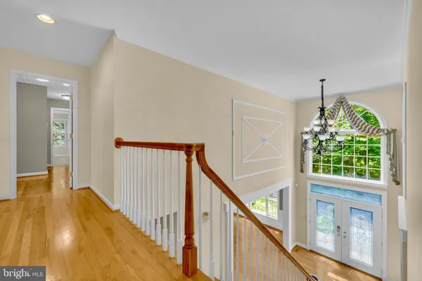 a view of an empty room with window and fire place
