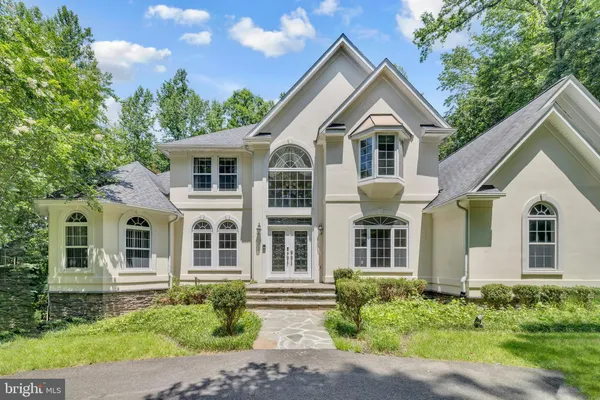 a aerial view of a house with a yard