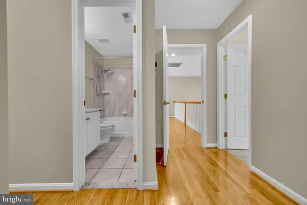an empty room with windows and closet area
