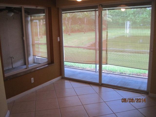5608 Crossing Rocks Court Riviera Beach, FL 33407 - Photo 5 of 10 VIEW TO PATIO