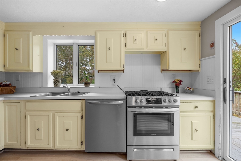 30 Mayflower Road Eastham, MA 02642 - Photo 11 of 38 a kitchen with cabinets appliances and a sink