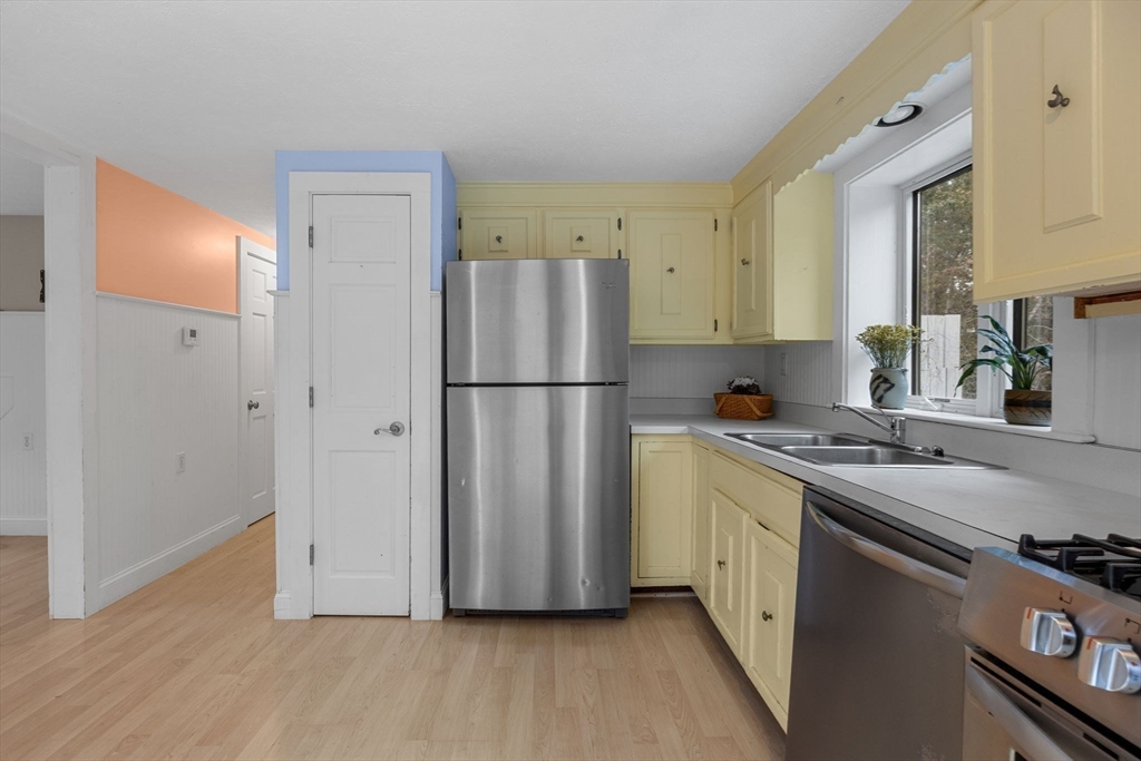 30 Mayflower Road Eastham, MA 02642 - Photo 12 of 38 a kitchen with a refrigerator sink and stove