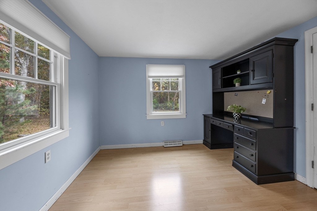 30 Mayflower Road Eastham, MA 02642 - Photo 15 of 38 a living room with a stove and a window