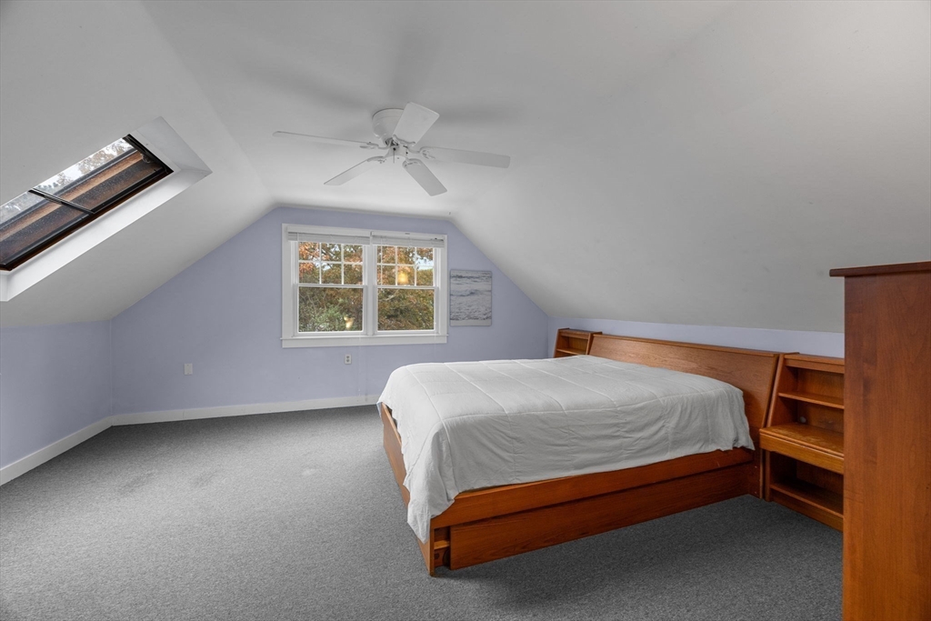 30 Mayflower Road Eastham, MA 02642 - Photo 20 of 38 a bed sitting in a bedroom next to a window