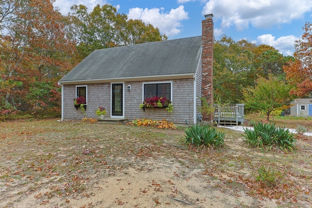30 Mayflower Road Eastham, MA 02642 - Photo 3 of 38 a view of a house with backyard and garden