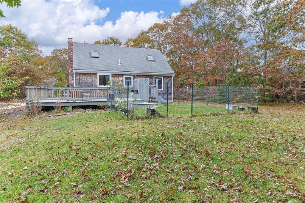 30 Mayflower Road Eastham, MA 02642 - Photo 32 of 38 front view of a house with a yard