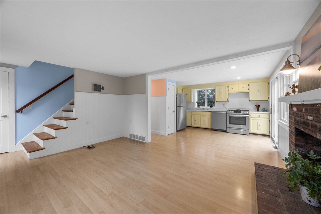 30 Mayflower Road Eastham, MA 02642 - Photo 9 of 38 a view of a kitchen with furniture and an empty room