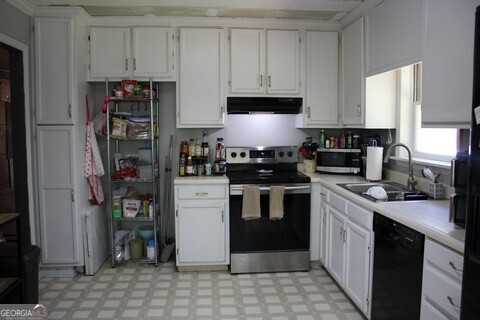 302 James Place Macon, GA 31220 - Photo 4 of 9 a kitchen with stainless steel appliances granite countertop a stove a refrigerator and a cabinets