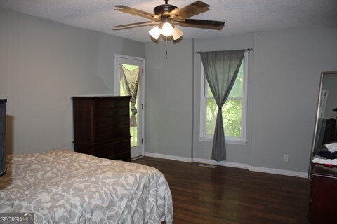 302 James Place Macon, GA 31220 - Photo 7 of 9 a bedroom with a bed and a chandelier
