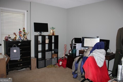 302 James Place Macon, GA 31220 - Photo 9 of 9 a bedroom with a bed and flat tv screen