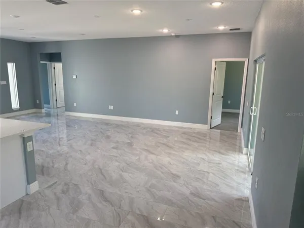 an empty room with a bathroom