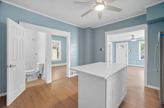 a view of a kitchen from the hallway