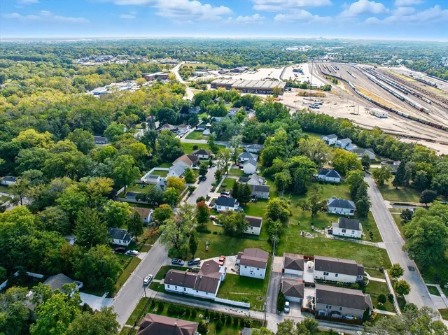 an aerial view of residential houses with outdoor space