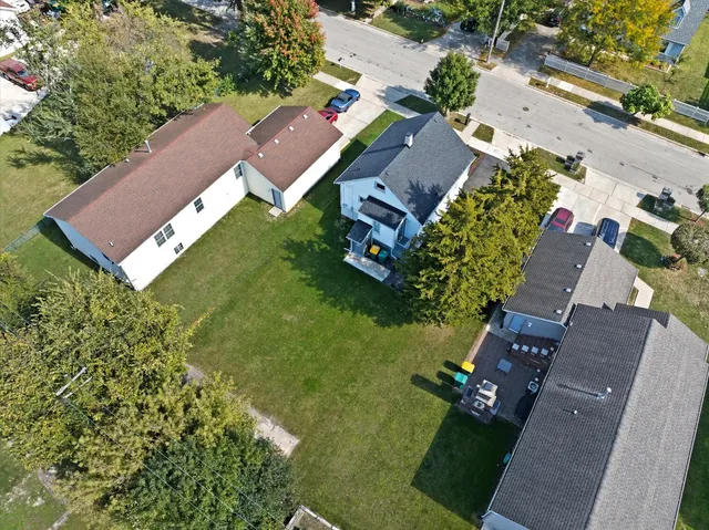 an aerial view of a house with a garden