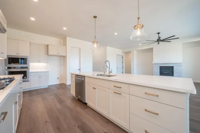 a kitchen with sink cabinets and window