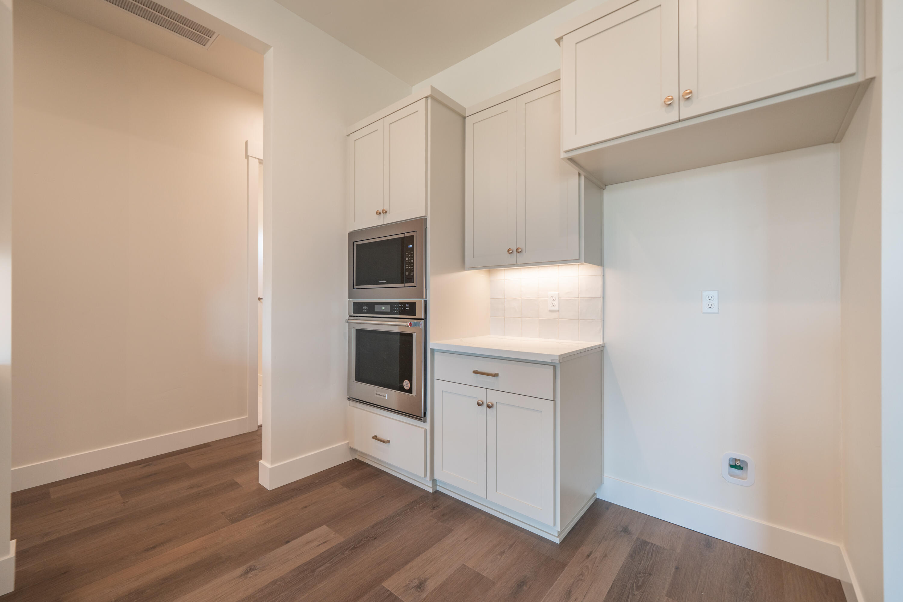 3792 Thomason Trail Redding, CA 96002 - Photo 17 of 42 a kitchen with white cabinets and white appliances