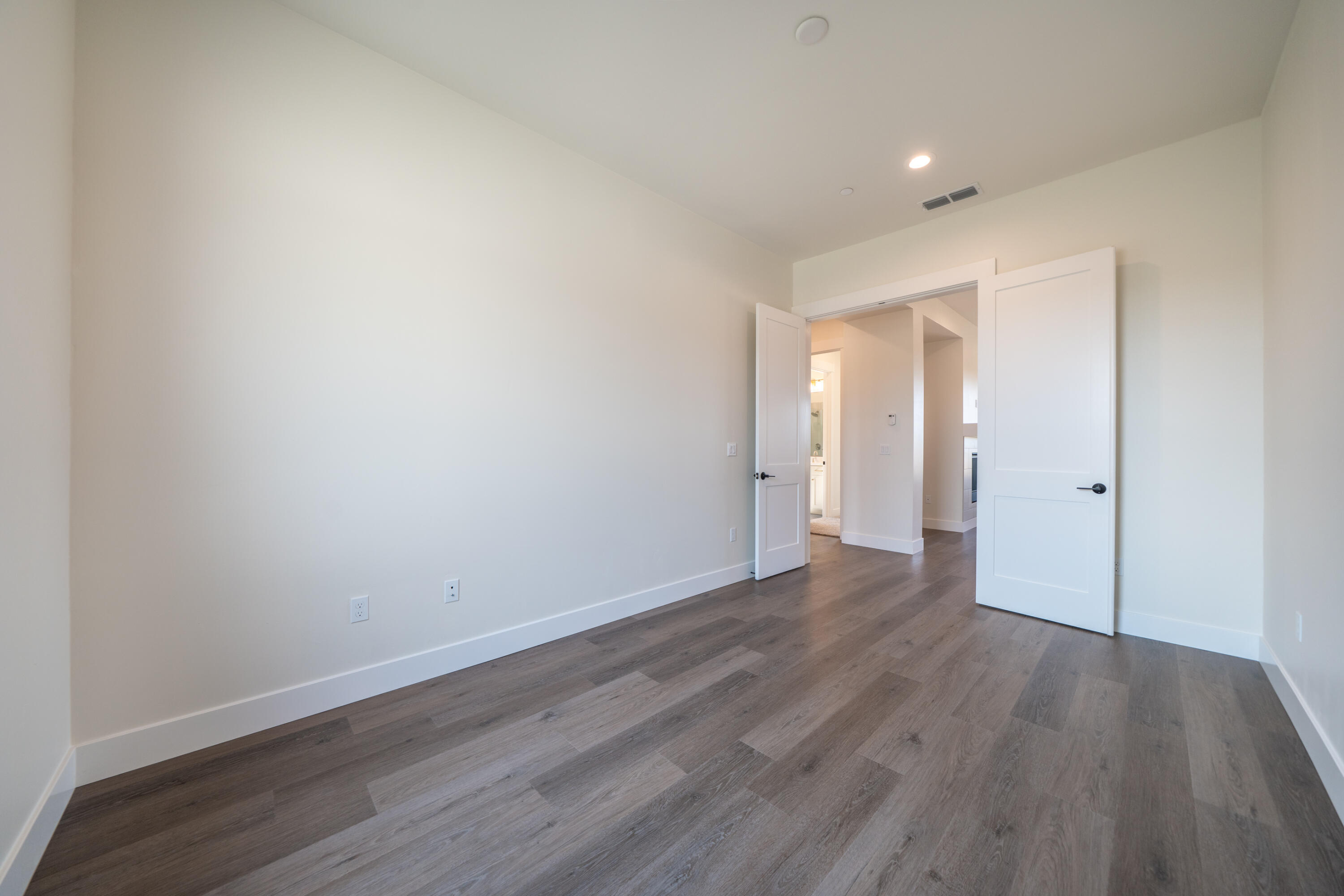 3792 Thomason Trail Redding, CA 96002 - Photo 20 of 42 a view of an empty room with wooden floor
