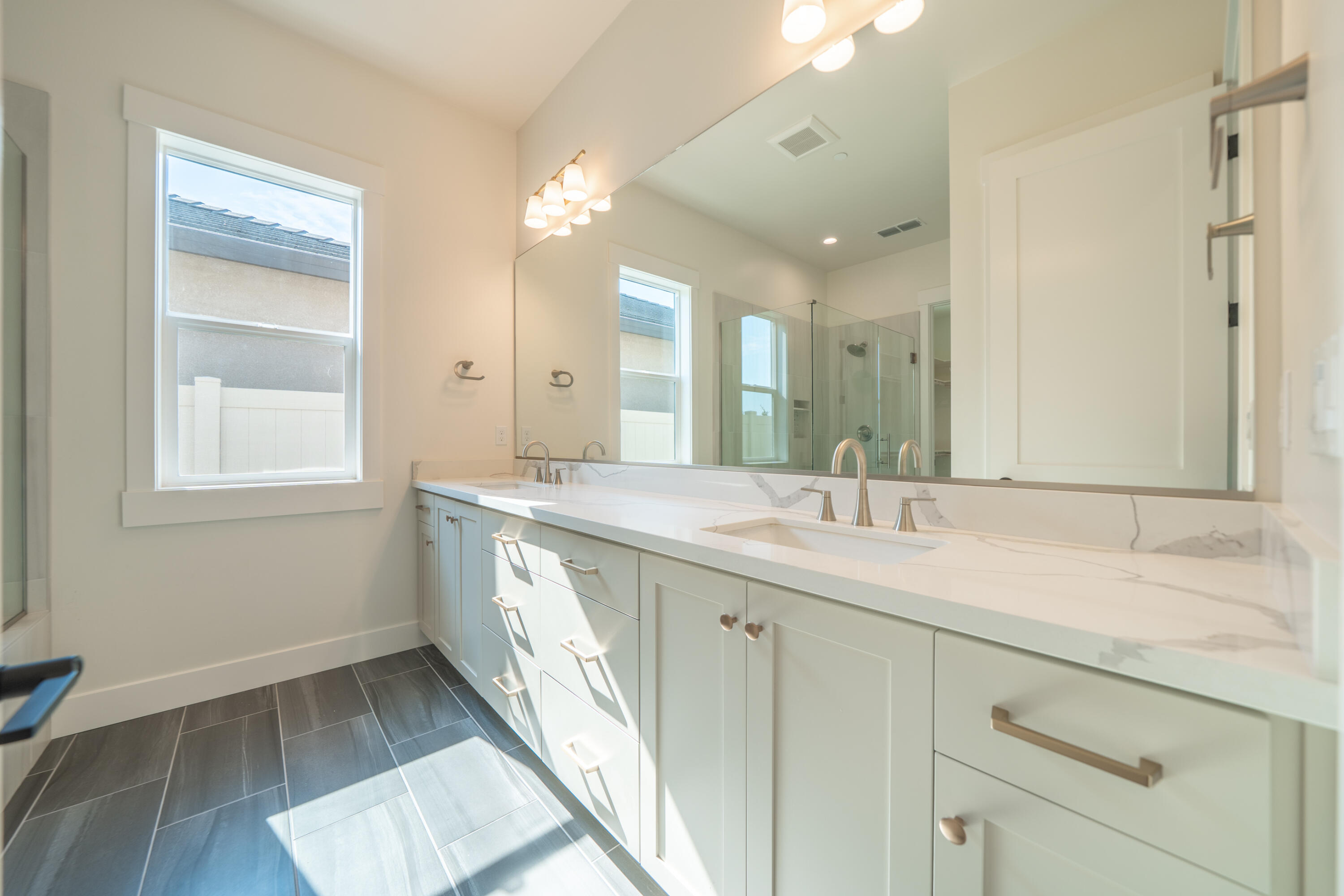 3792 Thomason Trail Redding, CA 96002 - Photo 27 of 42 a bathroom with a double vanity sink and a mirror