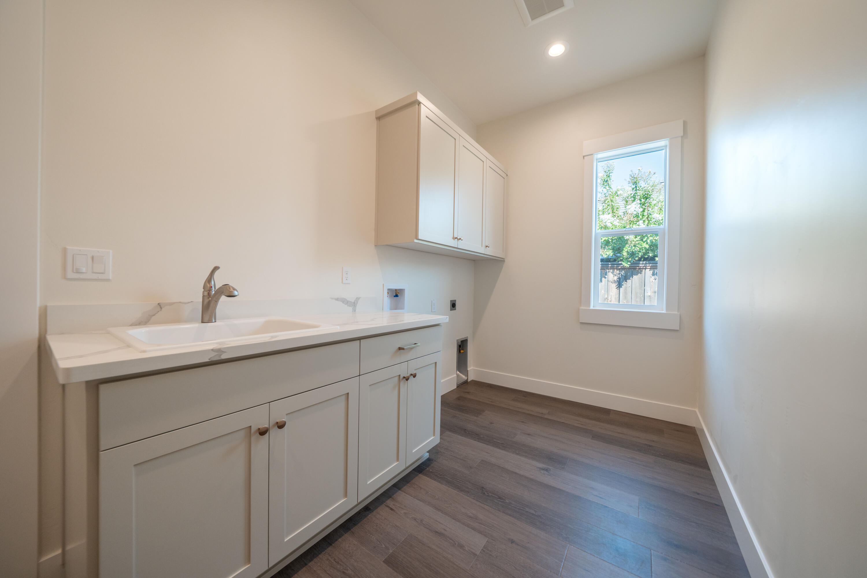 3792 Thomason Trail Redding, CA 96002 - Photo 32 of 42 a utility room with a sink dryer and washer