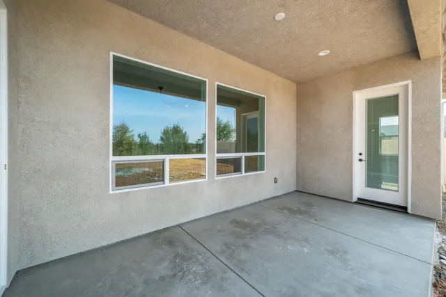 a backyard of a house with large trees
