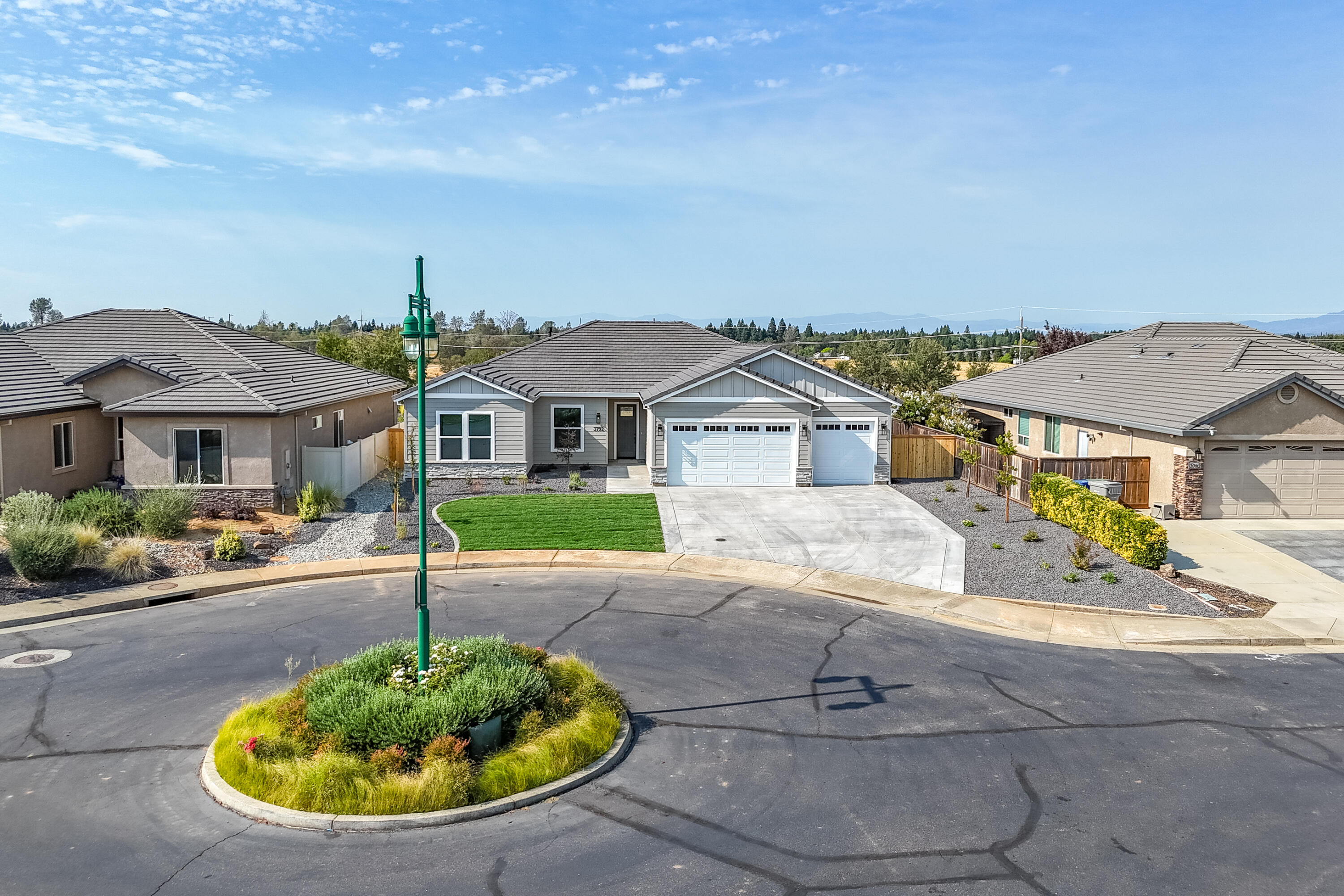 3792 Thomason Trail Redding, CA 96002 - Photo 36 of 42 a front view of a house with a garden