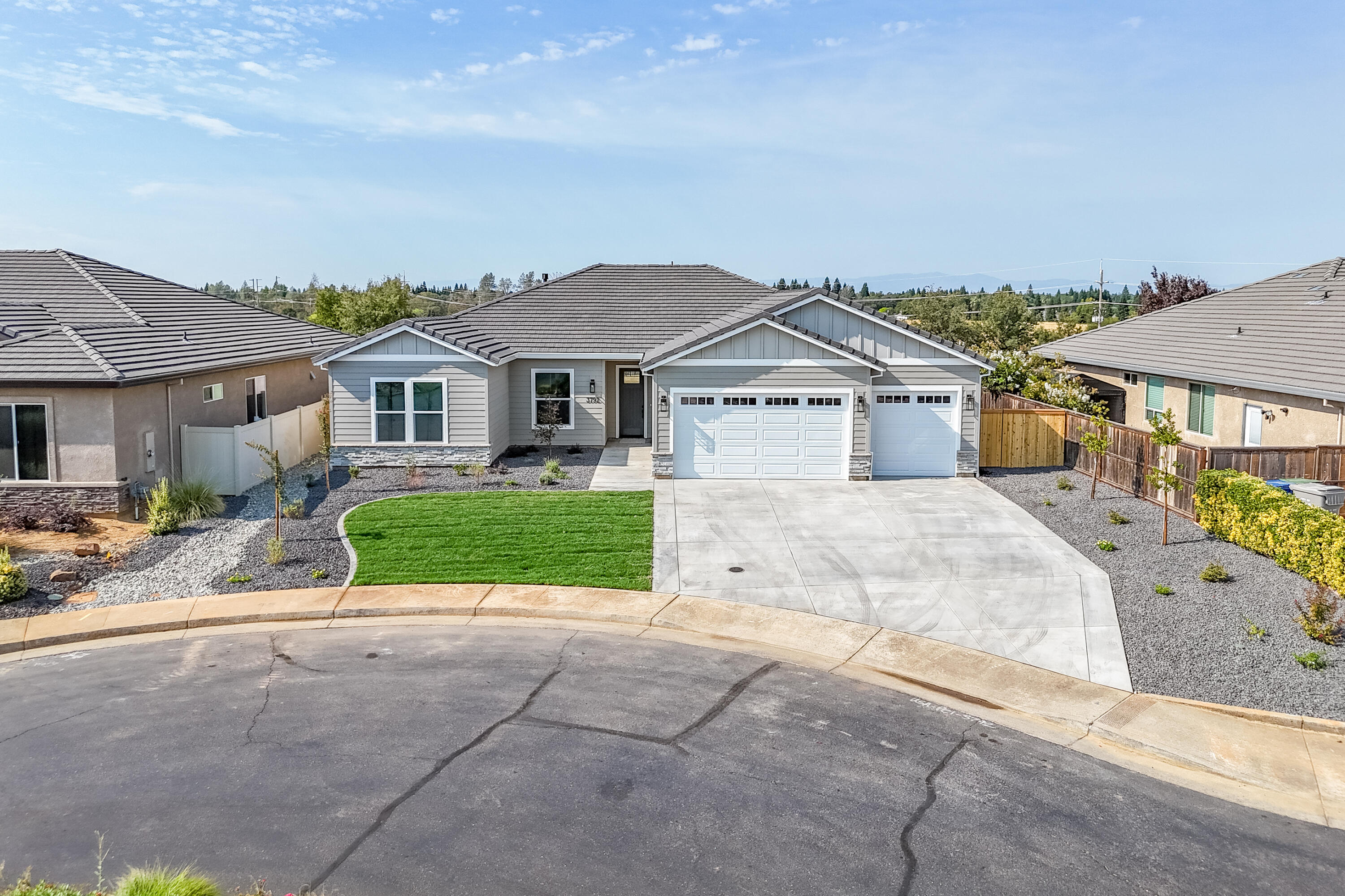 3792 Thomason Trail Redding, CA 96002 - Photo 37 of 42 a front view of a house with a yard and garage