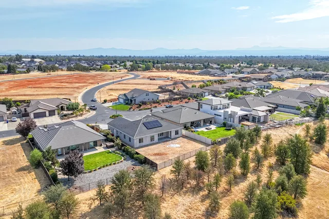 an aerial view of a house with swimming pool