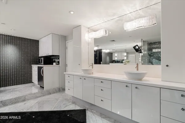 a kitchen with a sink and refrigerator