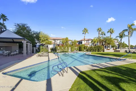 a view of a swimming pool with an outdoor space and seating area