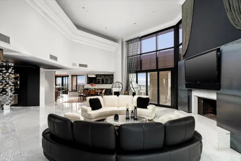 a living room with fireplace furniture and a flat screen tv