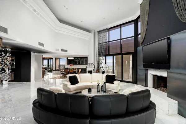 a living room with fireplace furniture and a flat screen tv